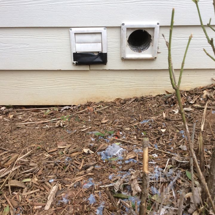 Damage to dryer vents on the side of a house